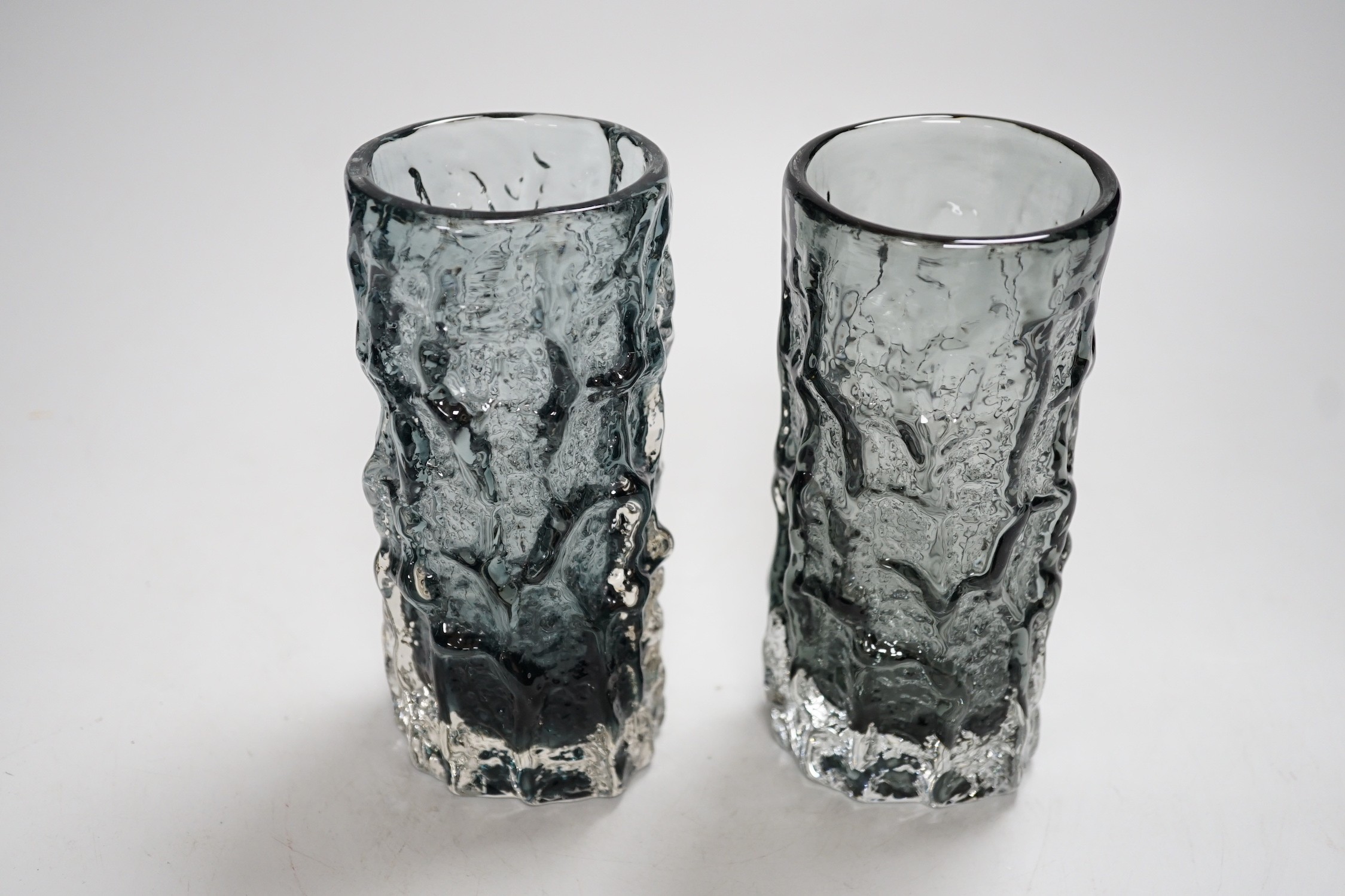 A pair of Whitefriars pewter glass bark vases. 15cm tall